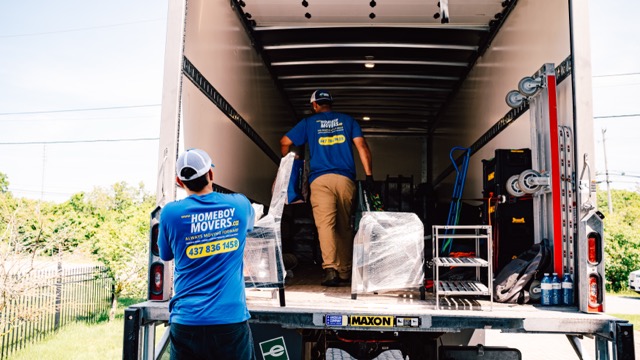The Homeboy Movers crew loading a truck together at a residential move
